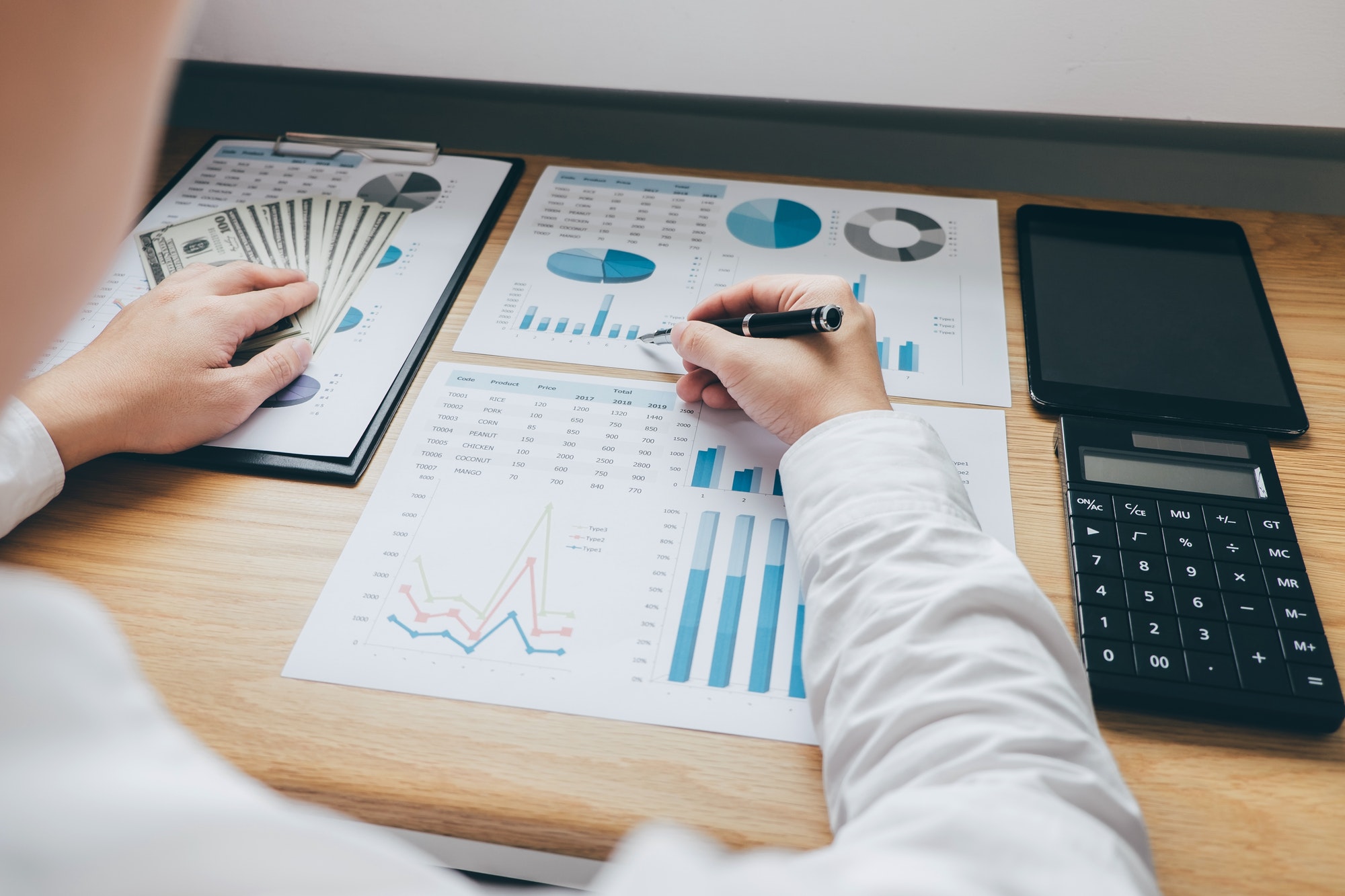 businessman-working-on-a-graph-document-financial-report-and-analysis-calculation-investment-cost.jpg businessman-working-on-a-graph-document-financial-report-and-analysis-calculation-investment-cost.jpg